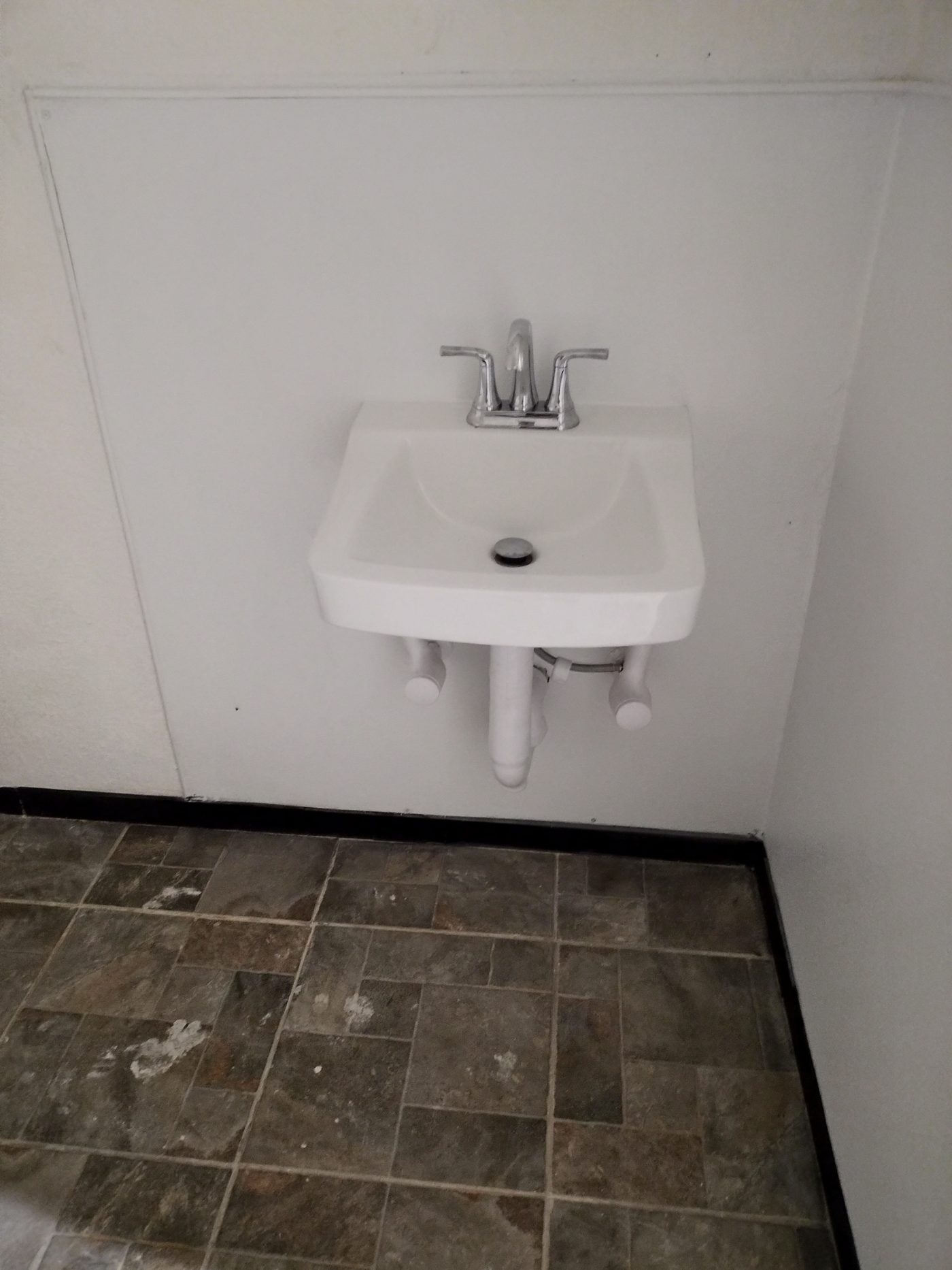 Wall-mounted bathroom sink installed