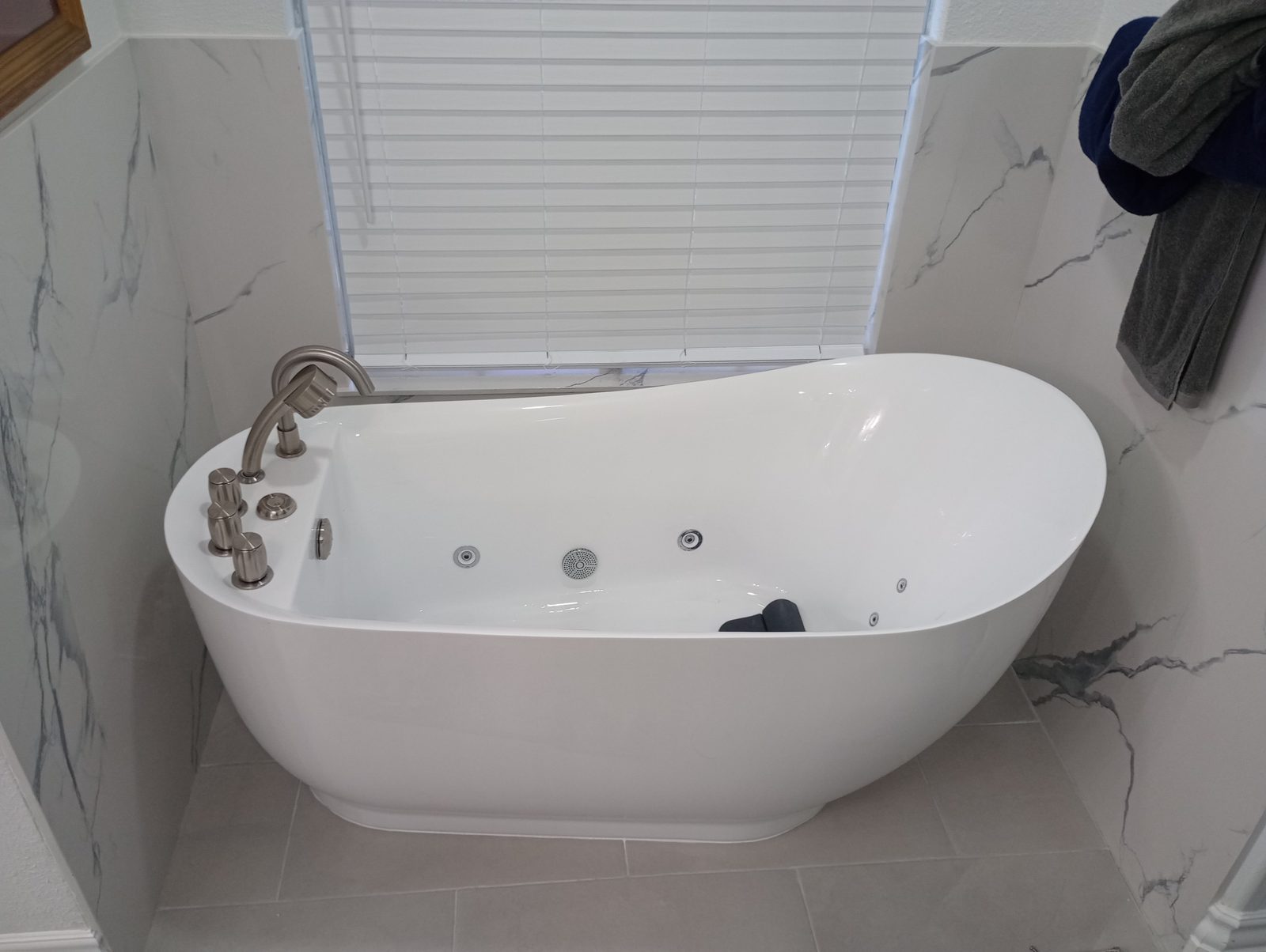 Freestanding soaking tub installed